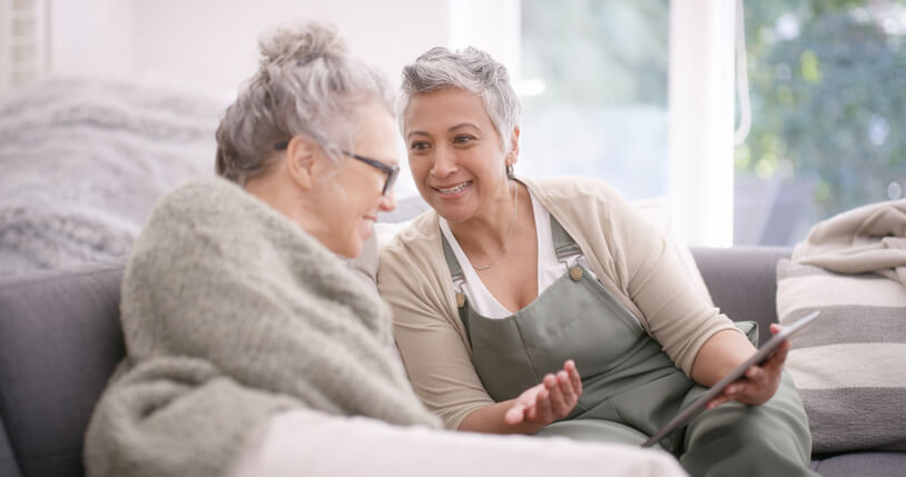 Caregiver engaging with senior in companionship
