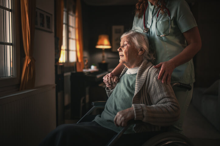 Elderly person receiving emergency home care at night